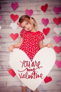 child looked after by a babysitter on Valentine's Day