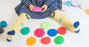 Child making play dough