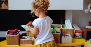 Child tidying his room